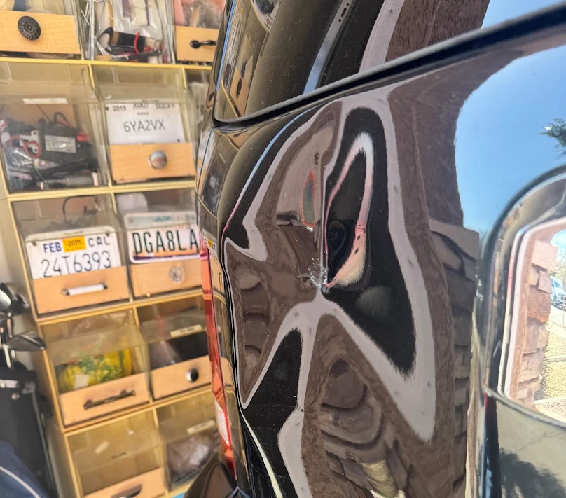 Tahoe · trunk dent. Before repair