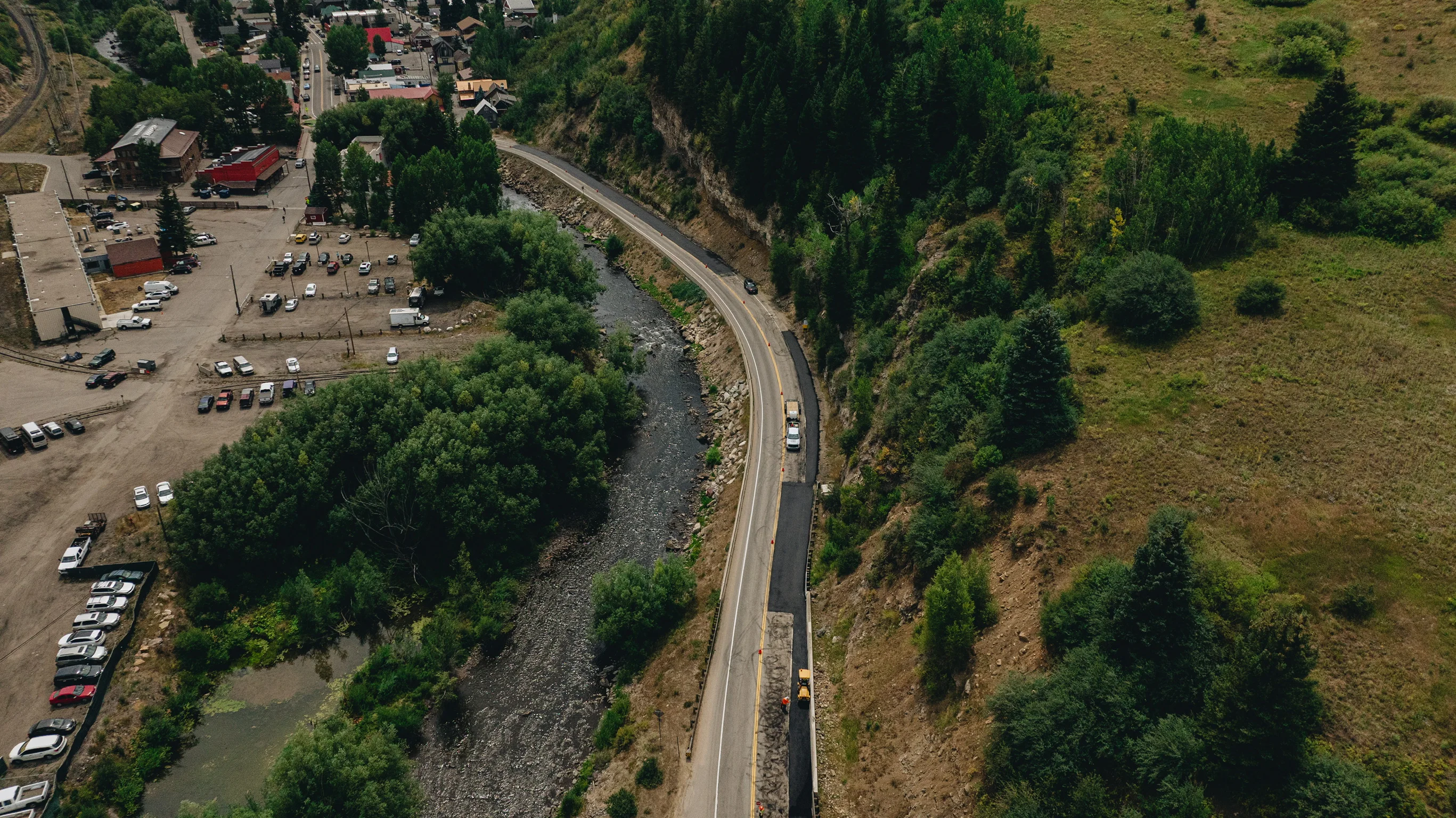 Wide aerial view of an MD Asphalt Colorado road project